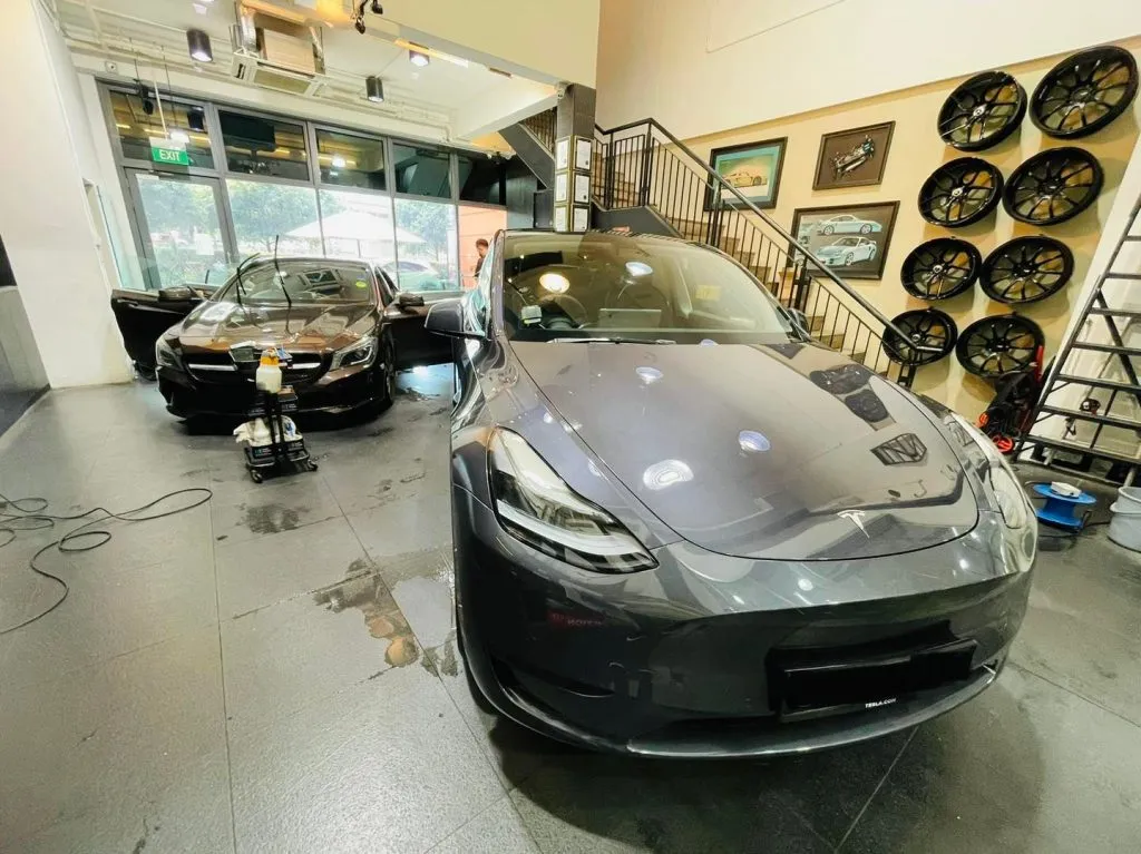 Grey Tesla Model 3 and black Mercedes-Benz CLA at Infratint Singapore