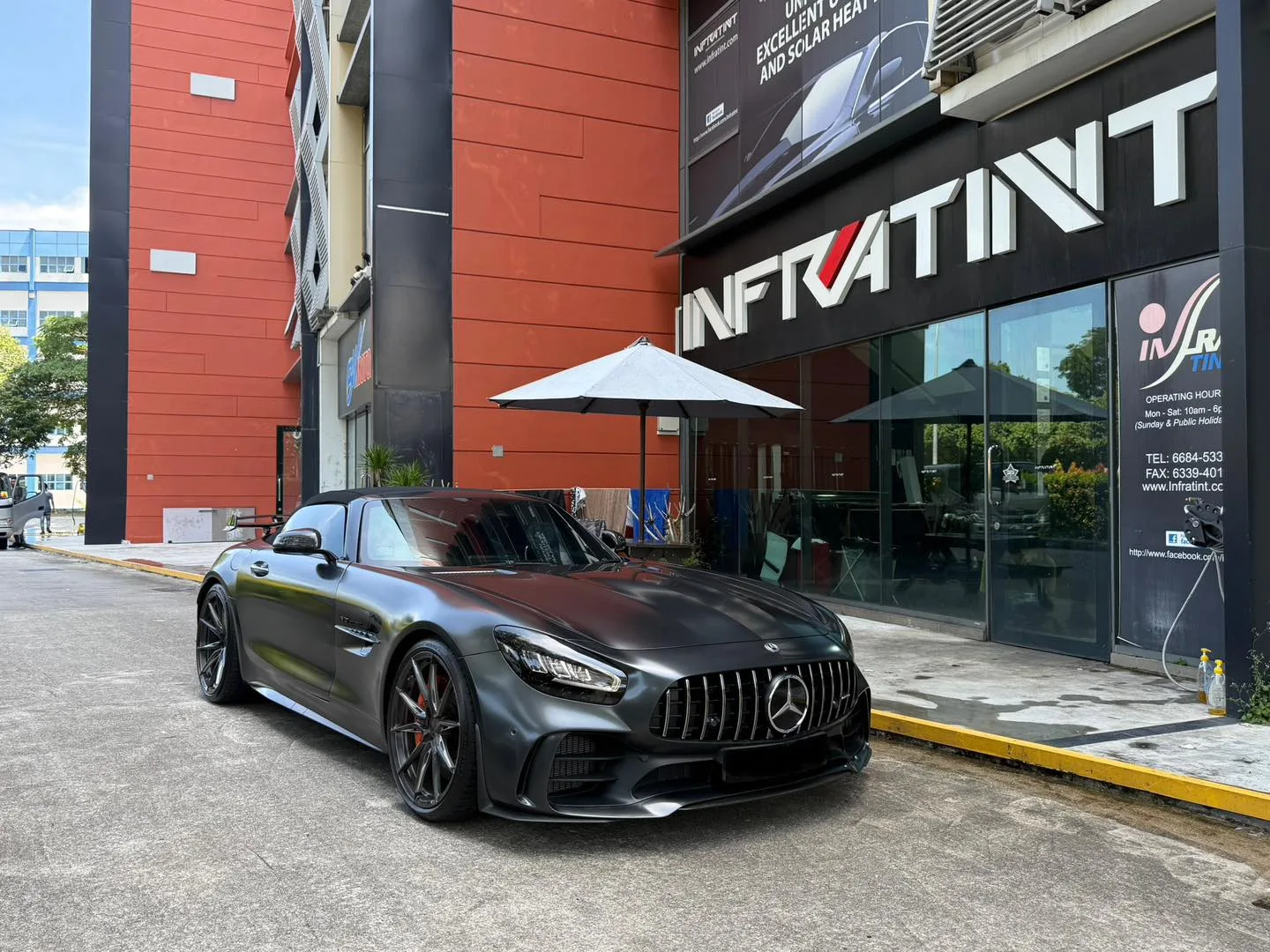 Matte grey Mercedes-AMG GT R front three-quarter view outside Infratint Singapore