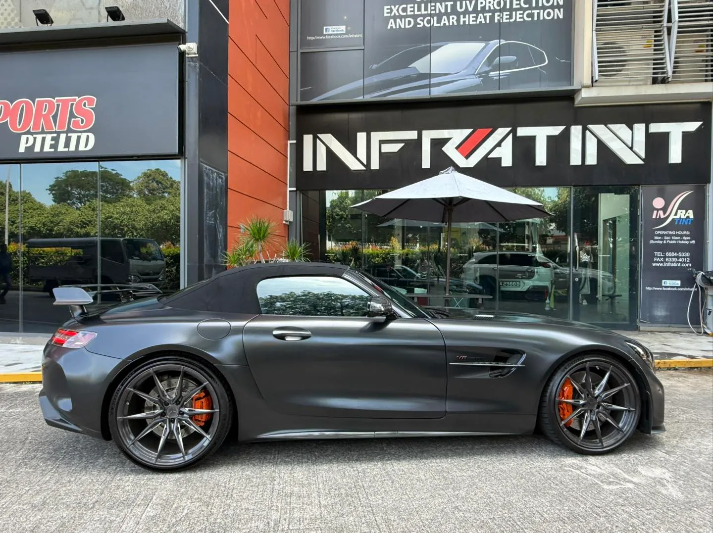 Matte grey Mercedes-AMG GT R side profile with rear wing outside Infratint Singapore