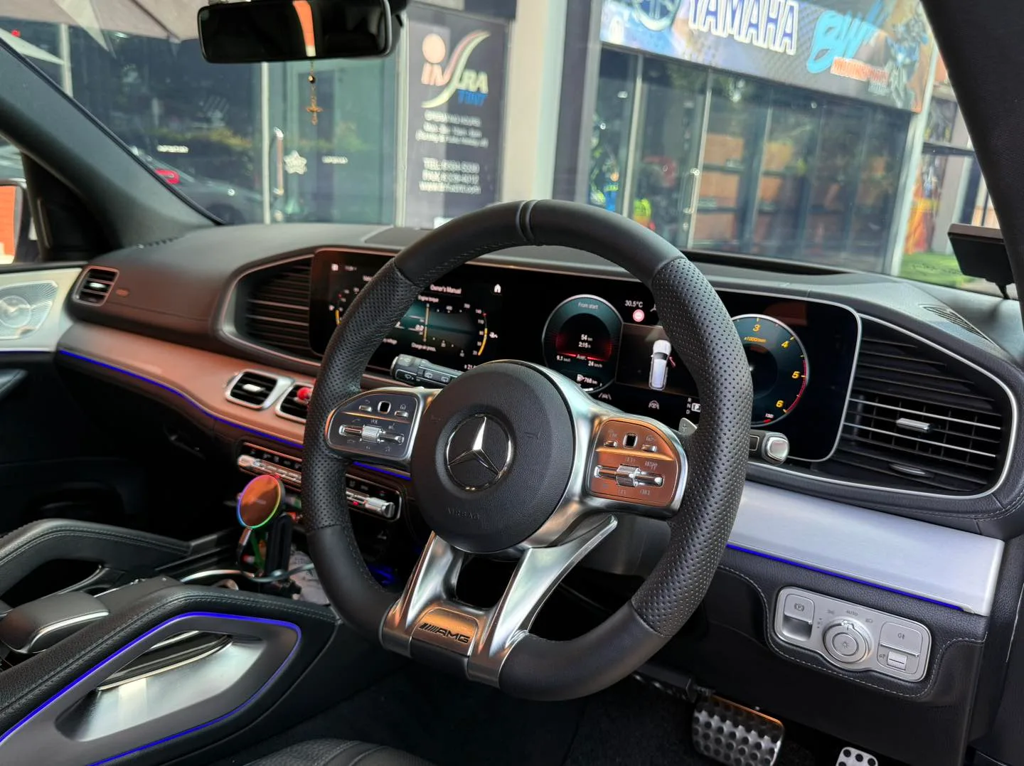 Mercedes-Benz GLS AMG steering wheel and dashboard seen through tinted glass at Infratint Singapore