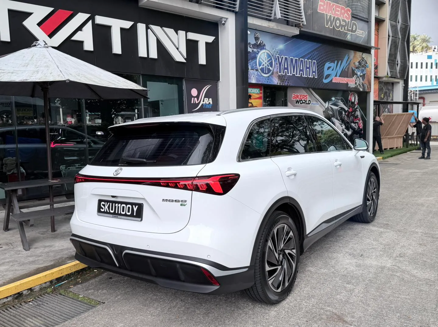 White MG S6 EV rear three-quarter view with tinted tailgate at Infratint Singapore