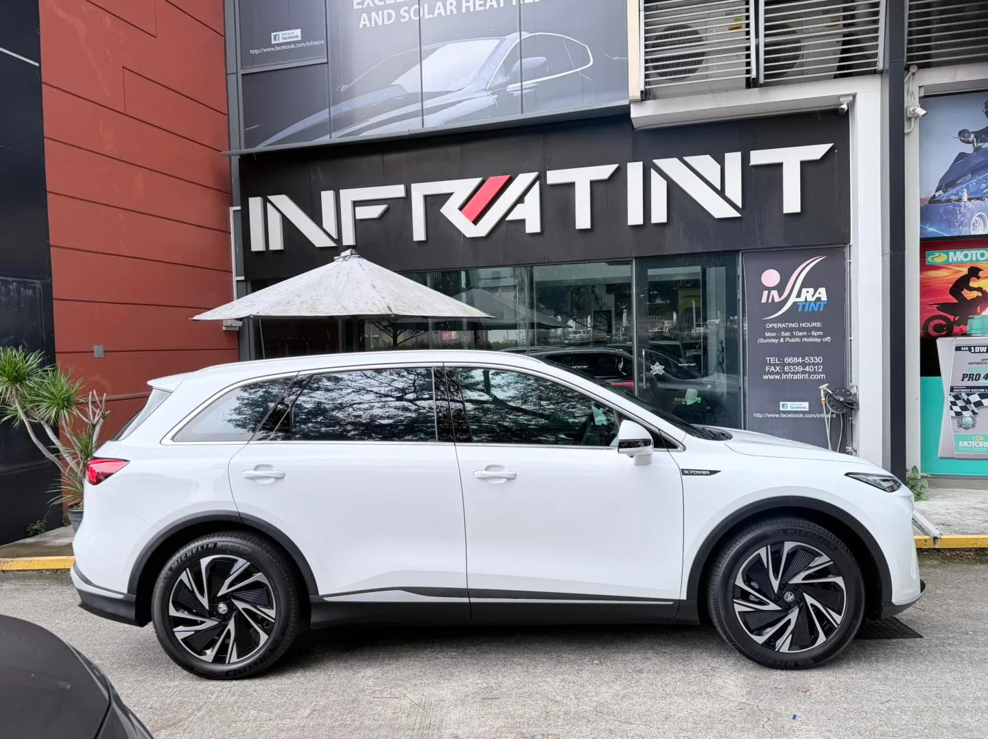 White MG S6 EV side profile with tinted windows at Infratint Singapore