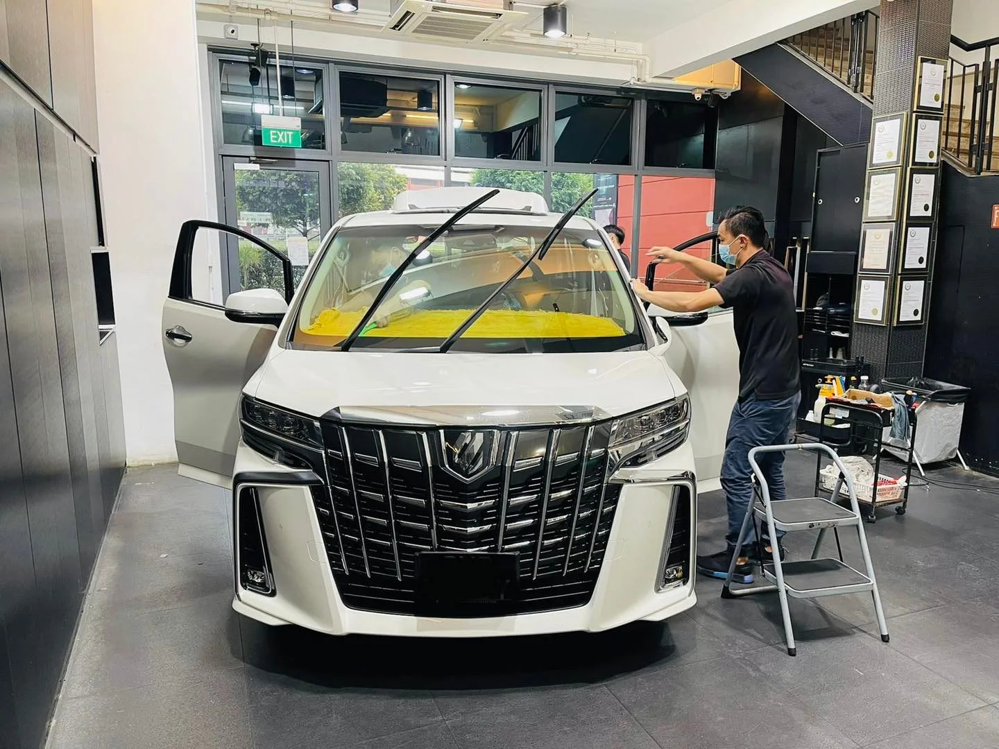 White Toyota Alphard having window film fitted at Infratint Singapore