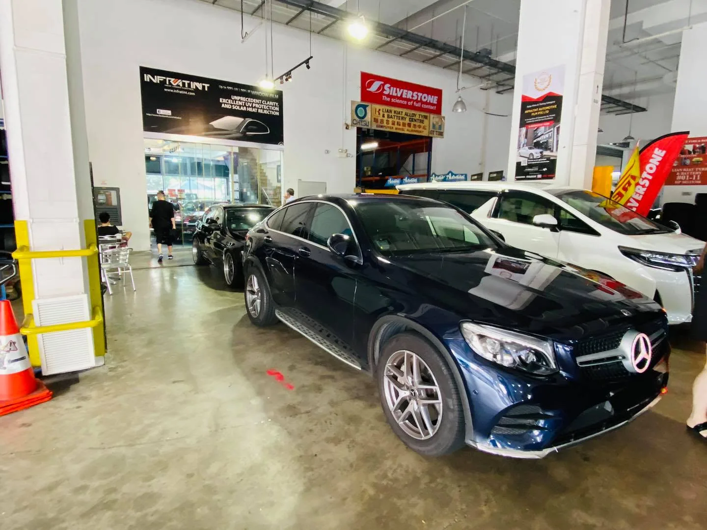 Dark blue Mercedes-Benz GLC Coupe in the install bay at Infratint Singapore