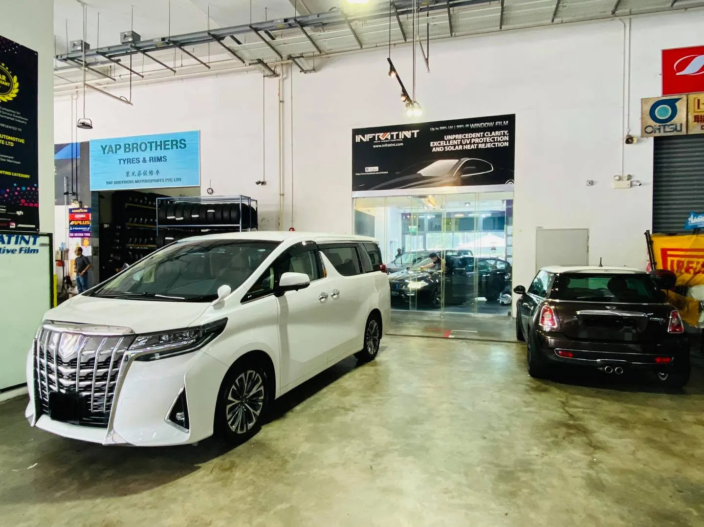 White Toyota Alphard in the install bay at Infratint Singapore for window tinting