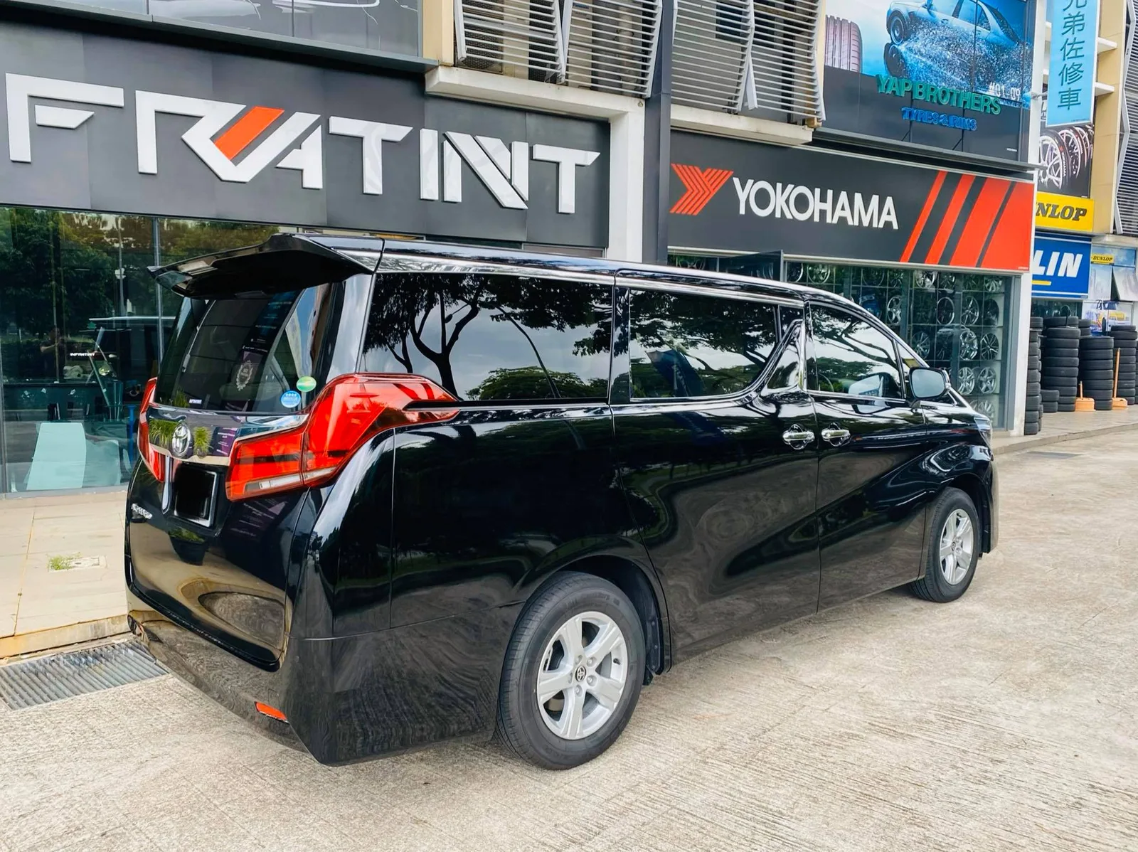 Black Toyota Alphard rear view outside Infratint Singapore after window tinting