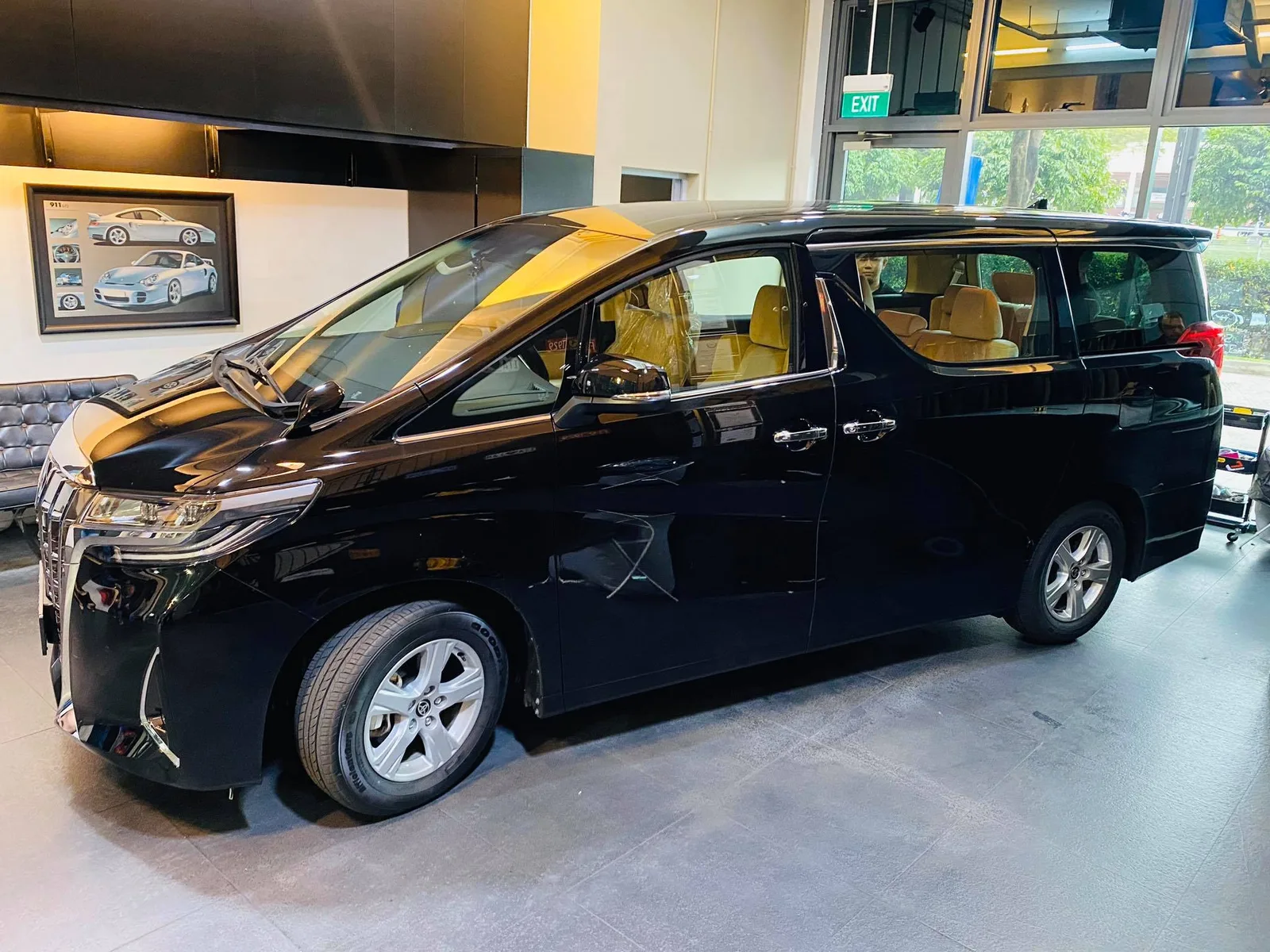 Black Toyota Alphard with beige interior and tinted windows at Infratint Singapore