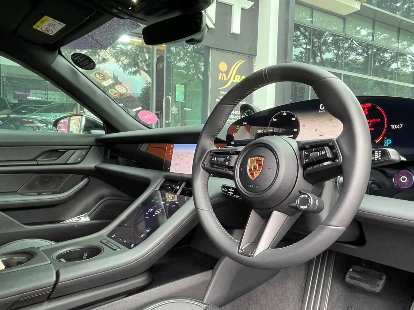 Porsche Taycan steering wheel and digital cockpit photographed at Infratint Singapore