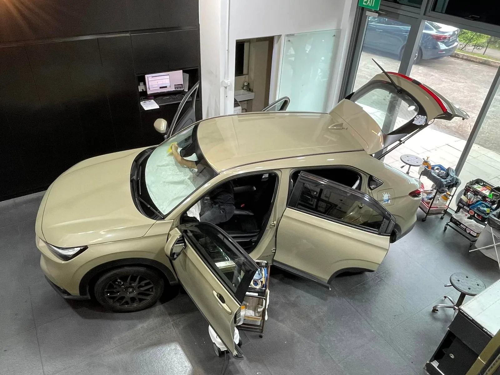 Overhead view of a sand Honda HR-V with doors open at Infratint Singapore