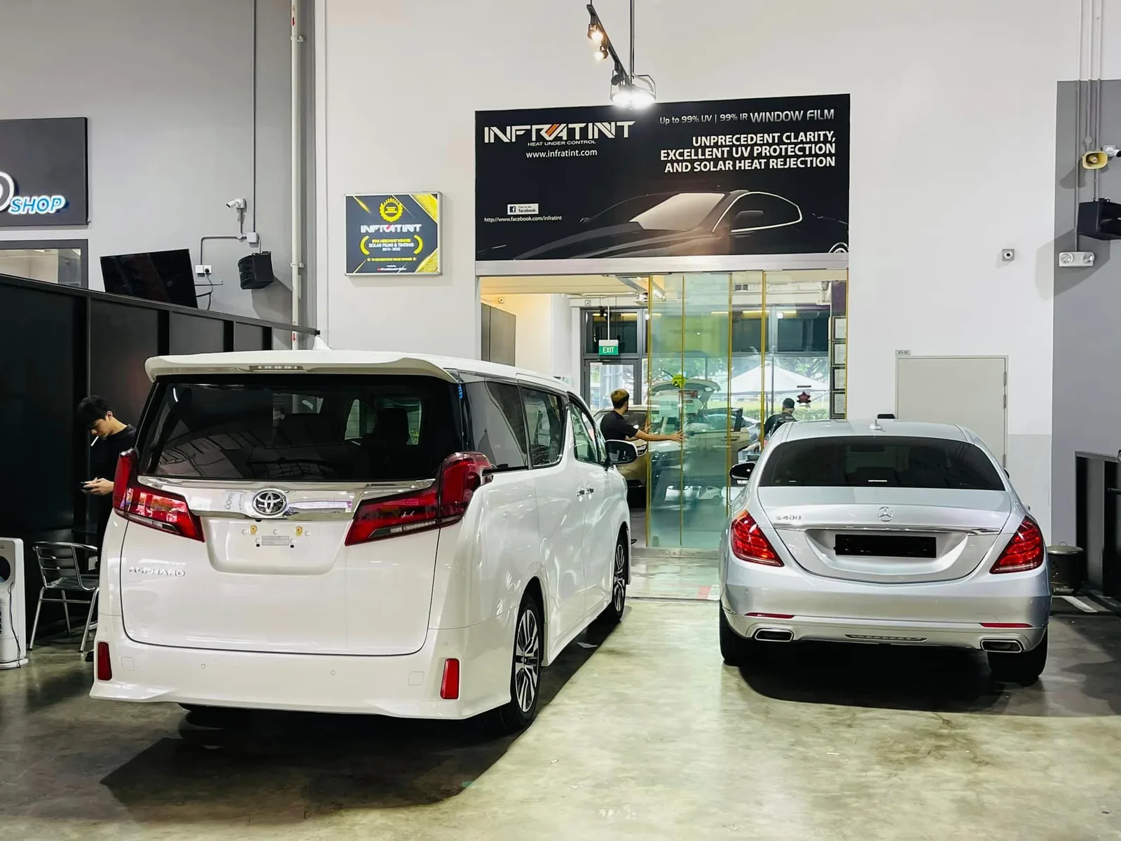 White Toyota Alphard and silver Mercedes-Benz S400 at Infratint Singapore