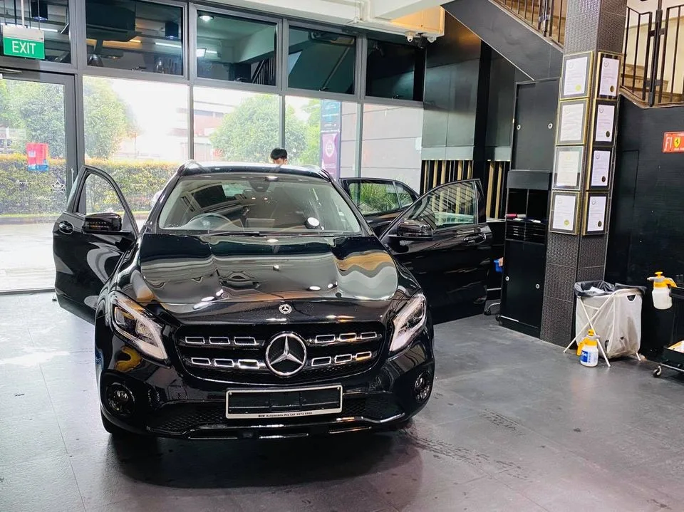 Black Mercedes-Benz GLA SUV being prepped for window film at Infratint Singapore