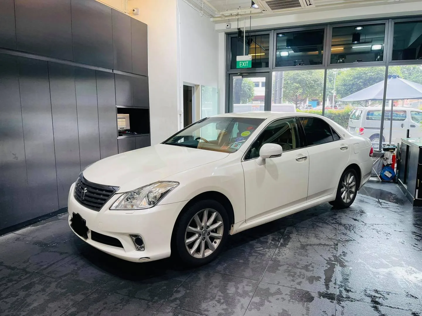 White Toyota Crown sedan in three-quarter view at Infratint Singapore