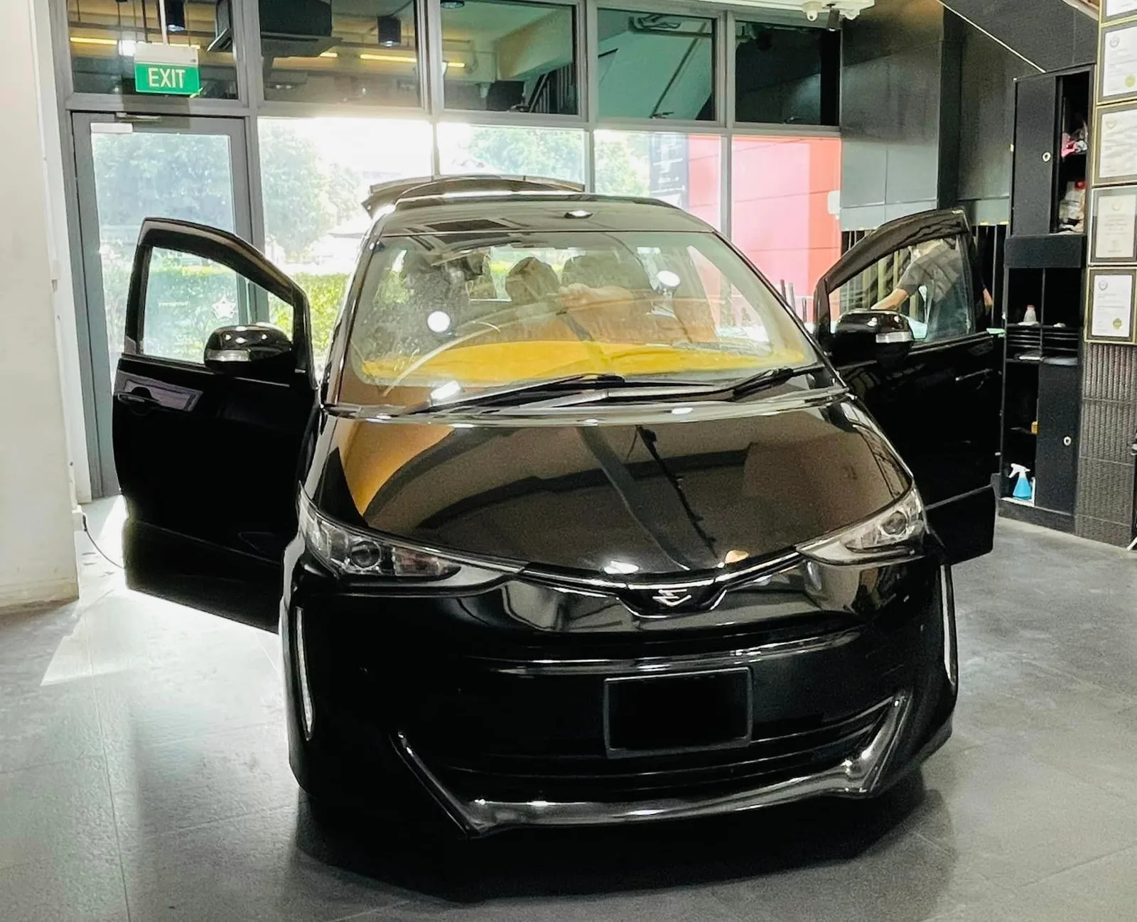 Black Toyota Estima front view with door open at Infratint Singapore window tinting