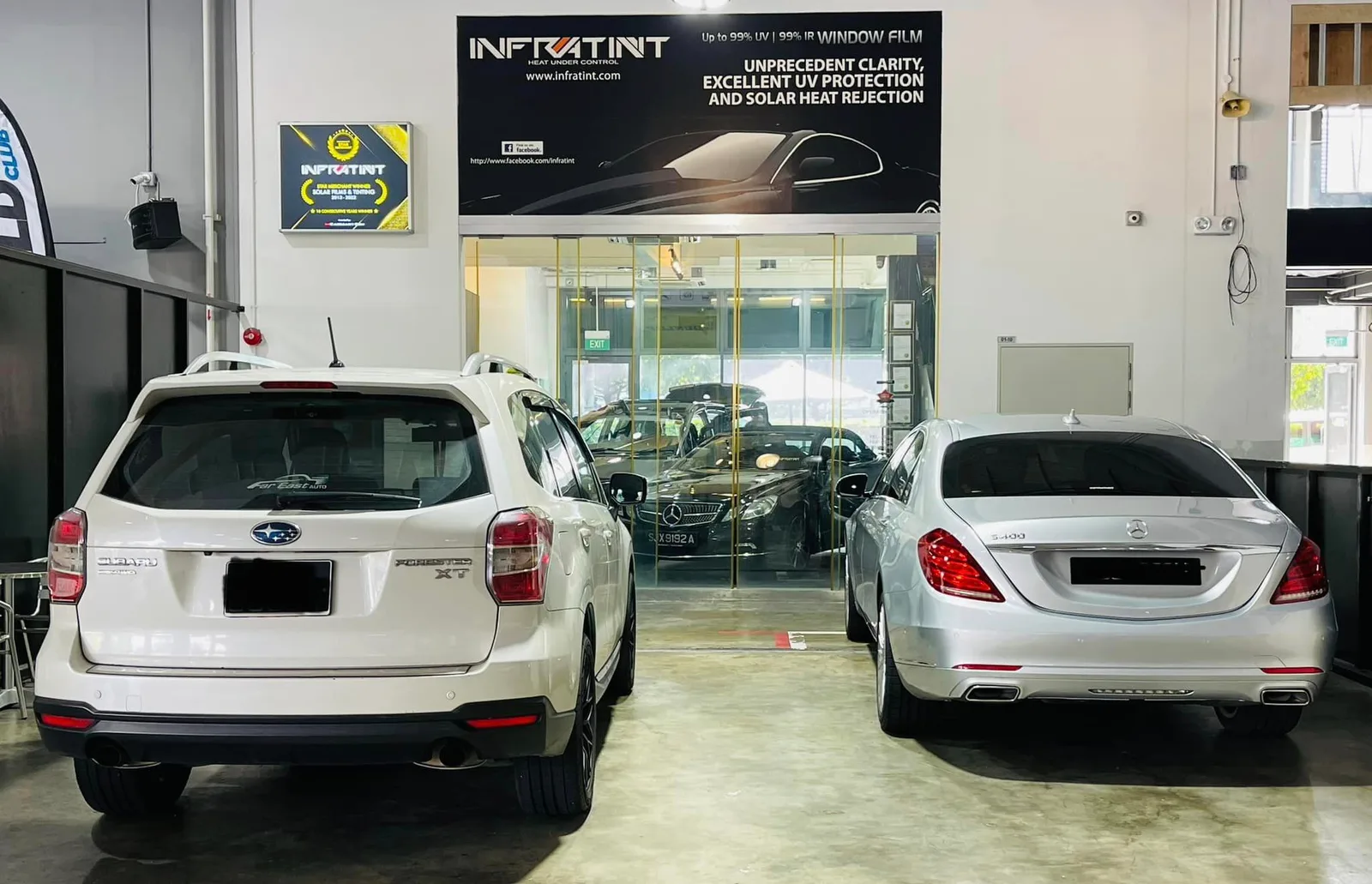 White Subaru Forester and silver Mercedes-Benz sedan at Infratint Singapore for window tinting