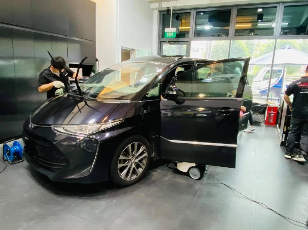 Dark Toyota Estima MPV having window film fitted at Infratint Singapore