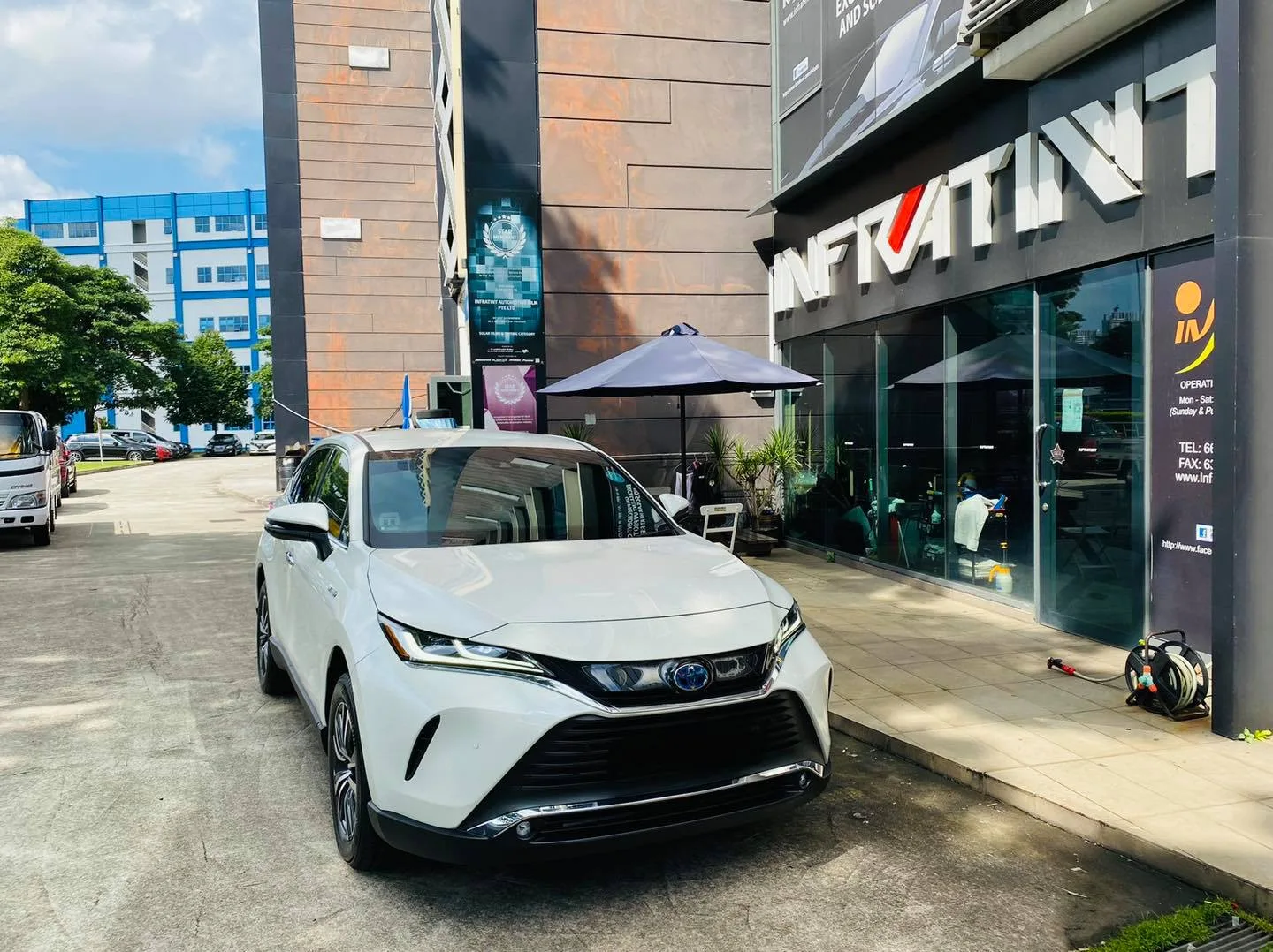 White Toyota Harrier parked outside the Infratint Singapore shopfront