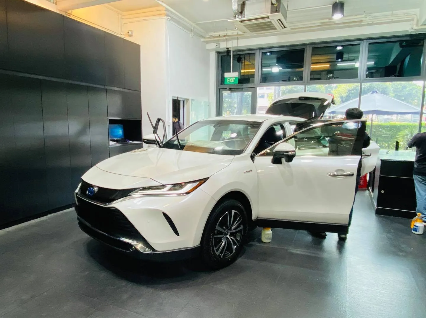 White Toyota Harrier with tailgate open during tinting at Infratint Singapore