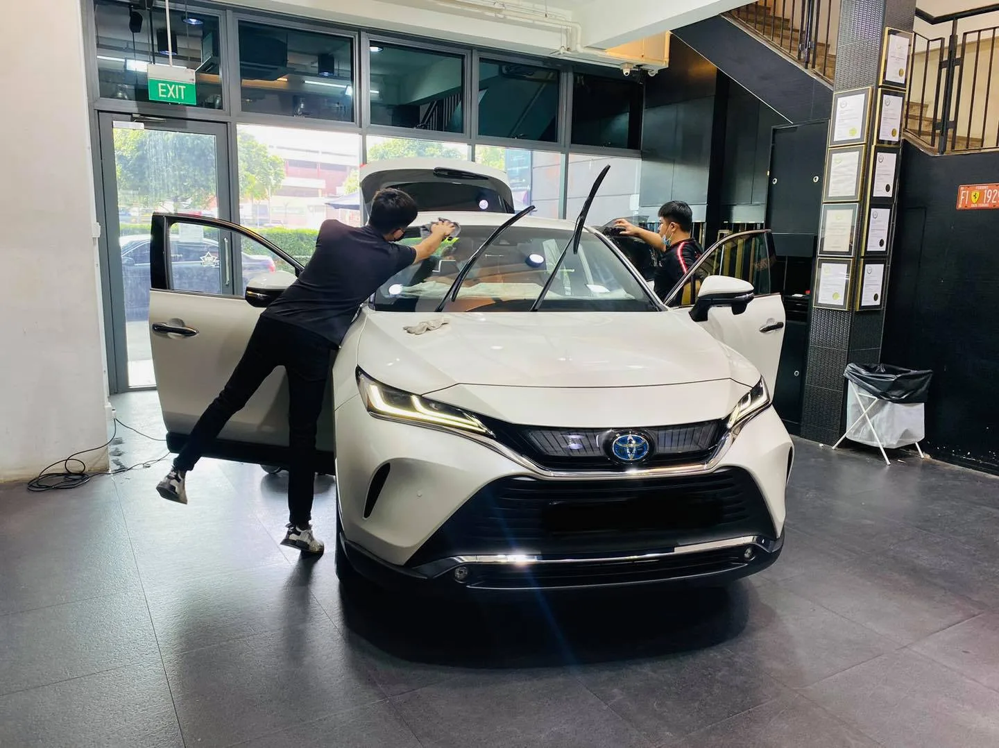White Toyota Harrier having window film fitted at the Infratint Singapore showroom