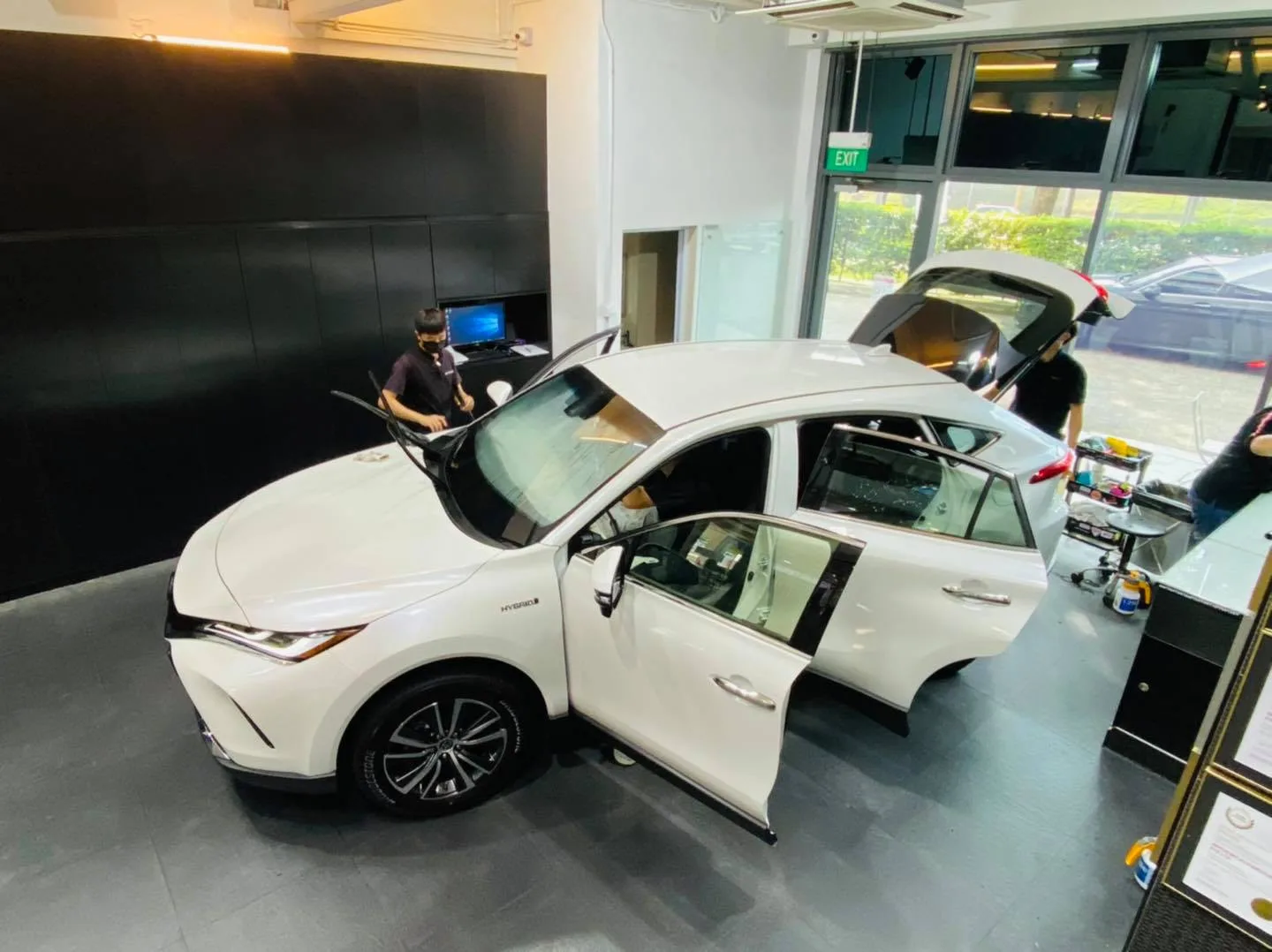 Overhead view of a white Toyota Harrier being tinted at Infratint Singapore