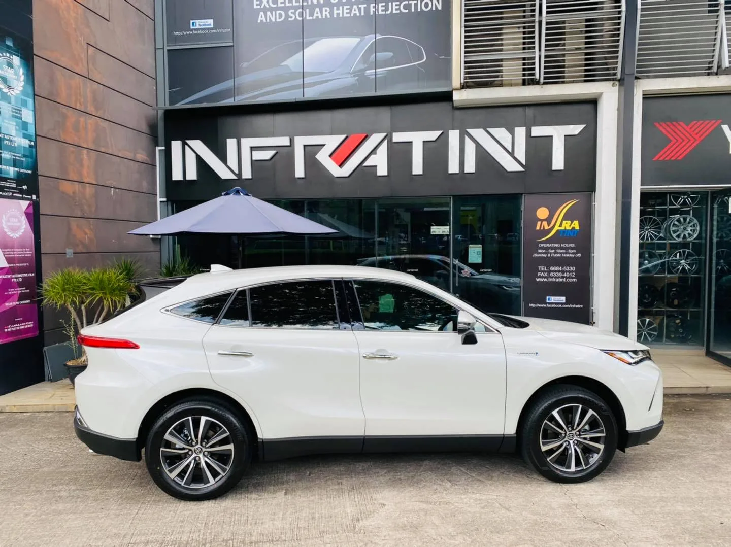 White Toyota Harrier side profile with tinted windows at Infratint Singapore