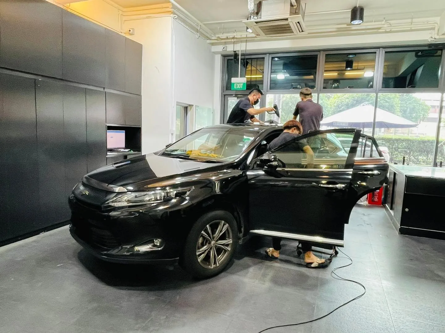 Black Toyota Harrier SUV during window tinting at Infratint Singapore