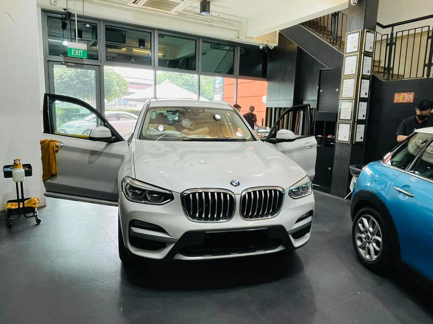 White BMW X1 SUV at Infratint Singapore for window tinting