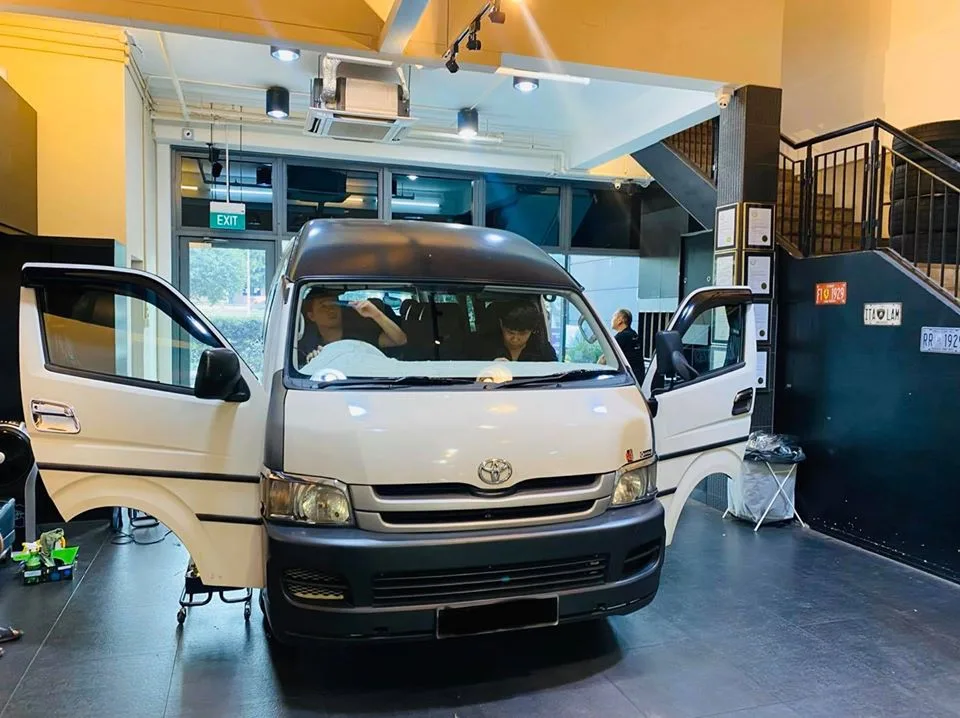 White Toyota Hiace van being prepared for window tinting at Infratint Singapore
