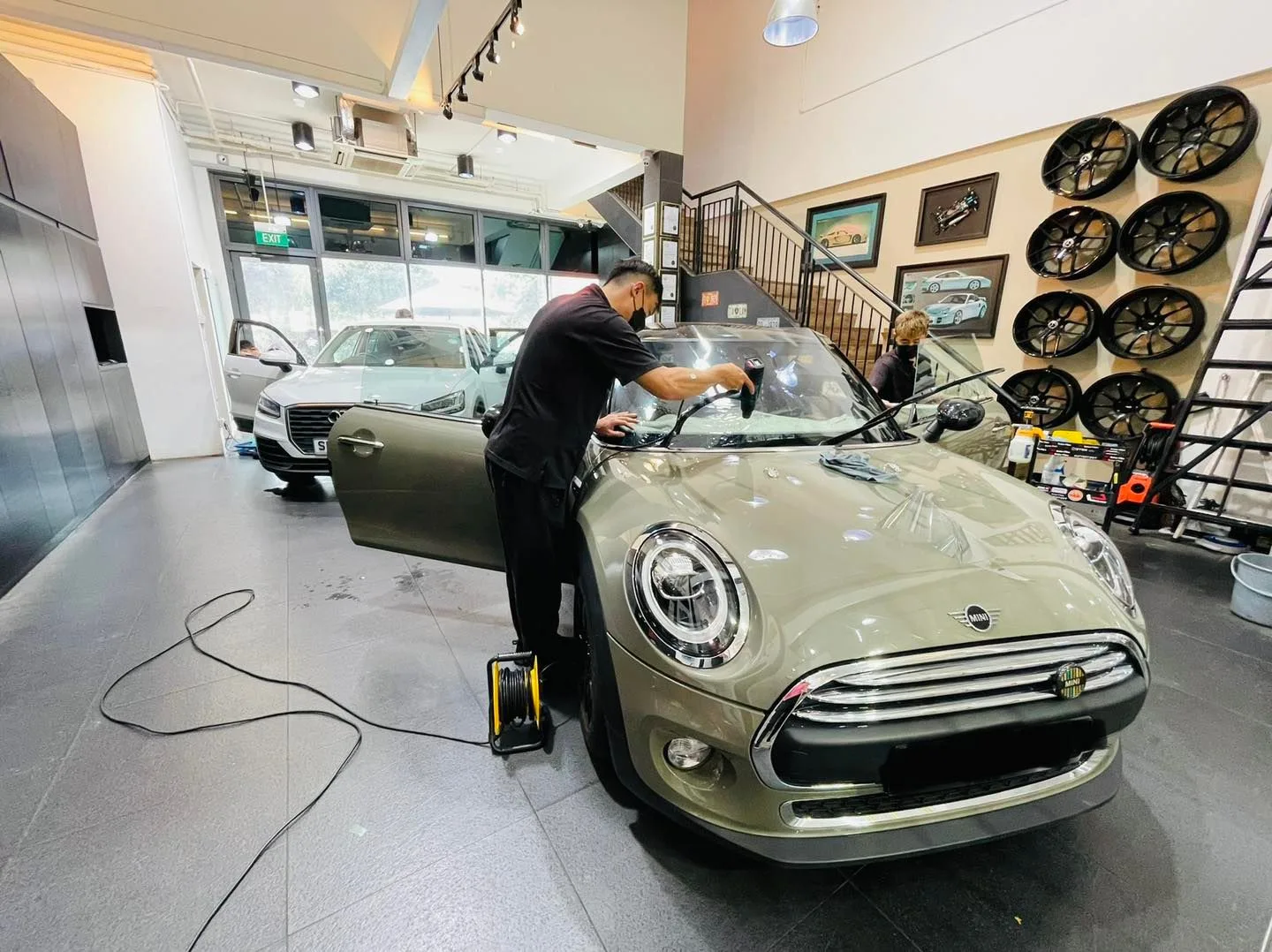 Sage green Mini Cooper getting windscreen film at Infratint Singapore