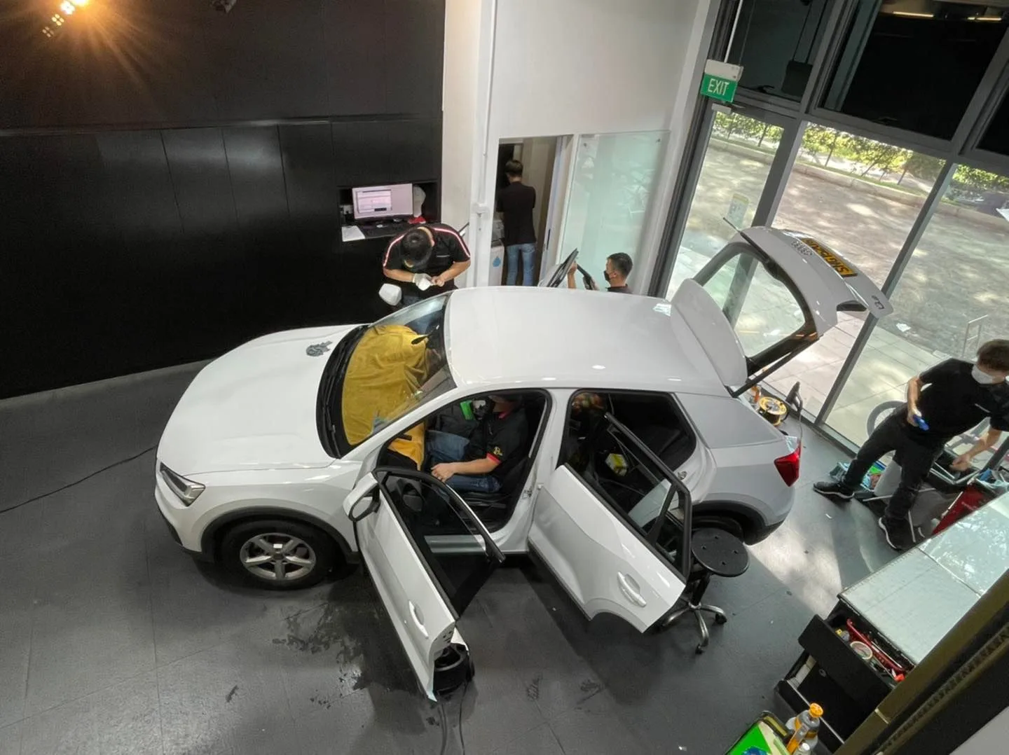 Overhead view of a white Audi Q2 with doors and tailgate open at Infratint Singapore