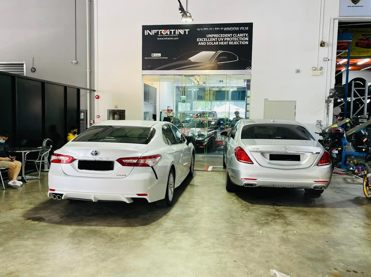 White Toyota Camry and Mercedes-Benz S-Class inside Infratint Singapore