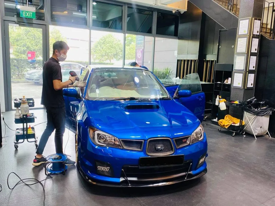 Blue Subaru WRX STI getting window film fitted at Infratint Singapore