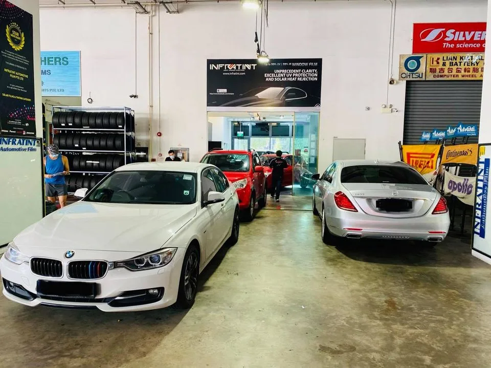 White BMW 3 Series and silver Mercedes-Benz S-Class queued at Infratint Singapore