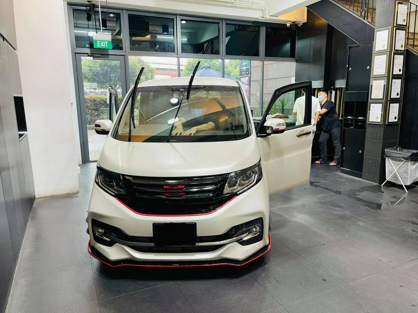 White Honda MPV with door open during window tinting at Infratint Singapore
