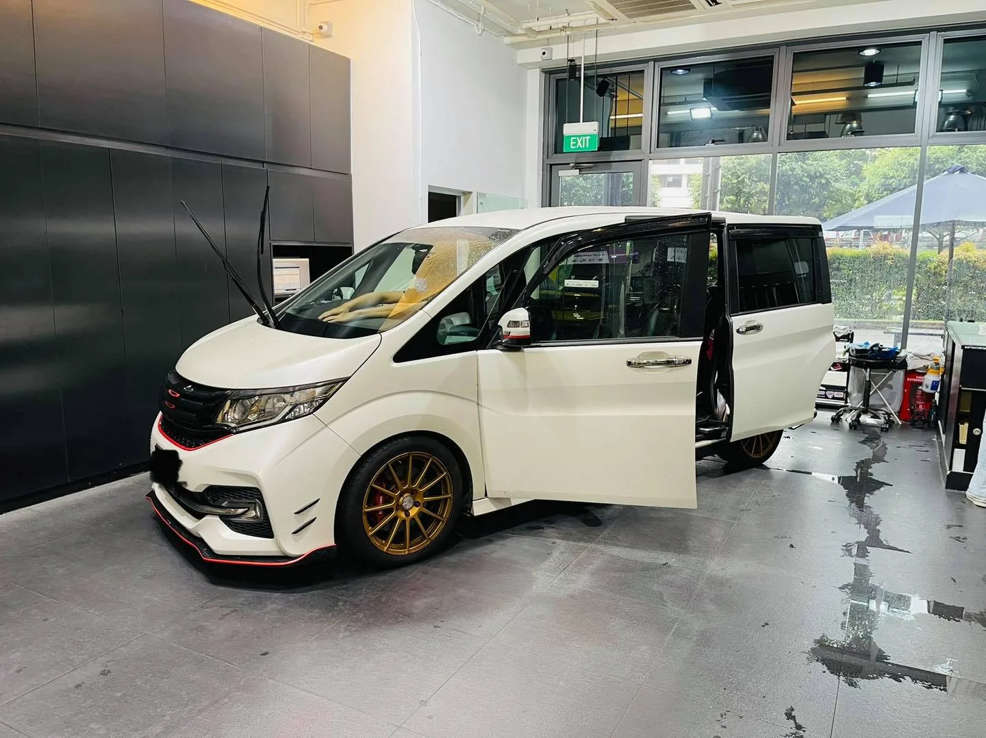 White Honda MPV on gold wheels with sliding door open at Infratint Singapore