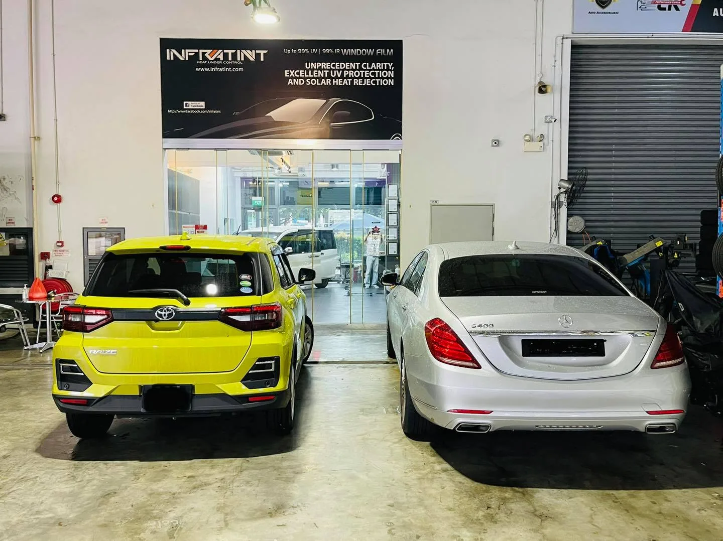Yellow Toyota Raize and silver Mercedes-Benz S-Class at Infratint Singapore for window film