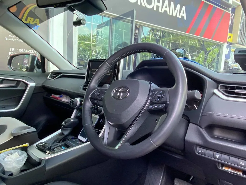 Toyota RAV4 interior and steering wheel viewed through tinted windows at Infratint Singapore