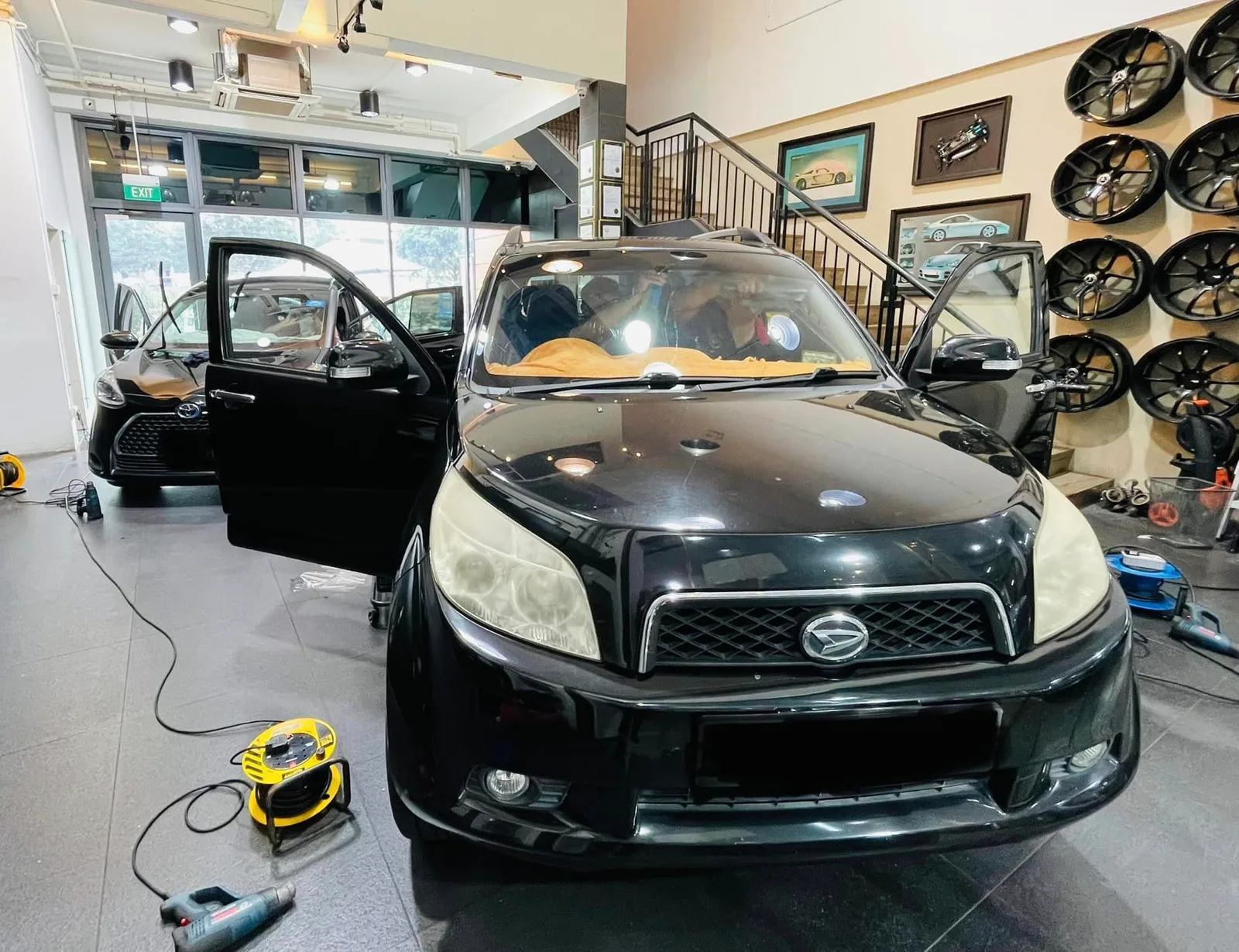 Black Daihatsu SUV being tinted at Infratint Singapore