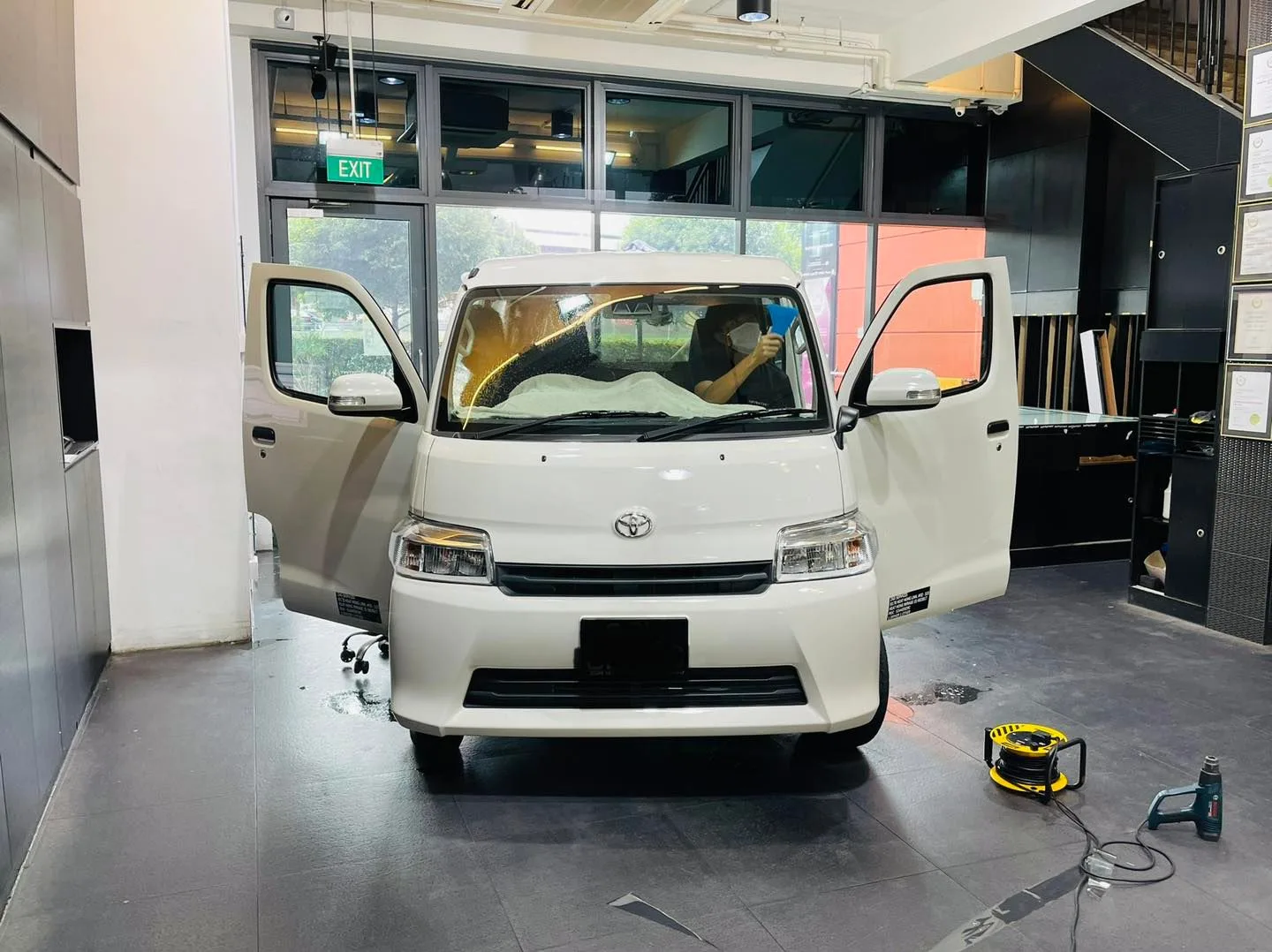 White Toyota Townace van during window tinting at Infratint Singapore