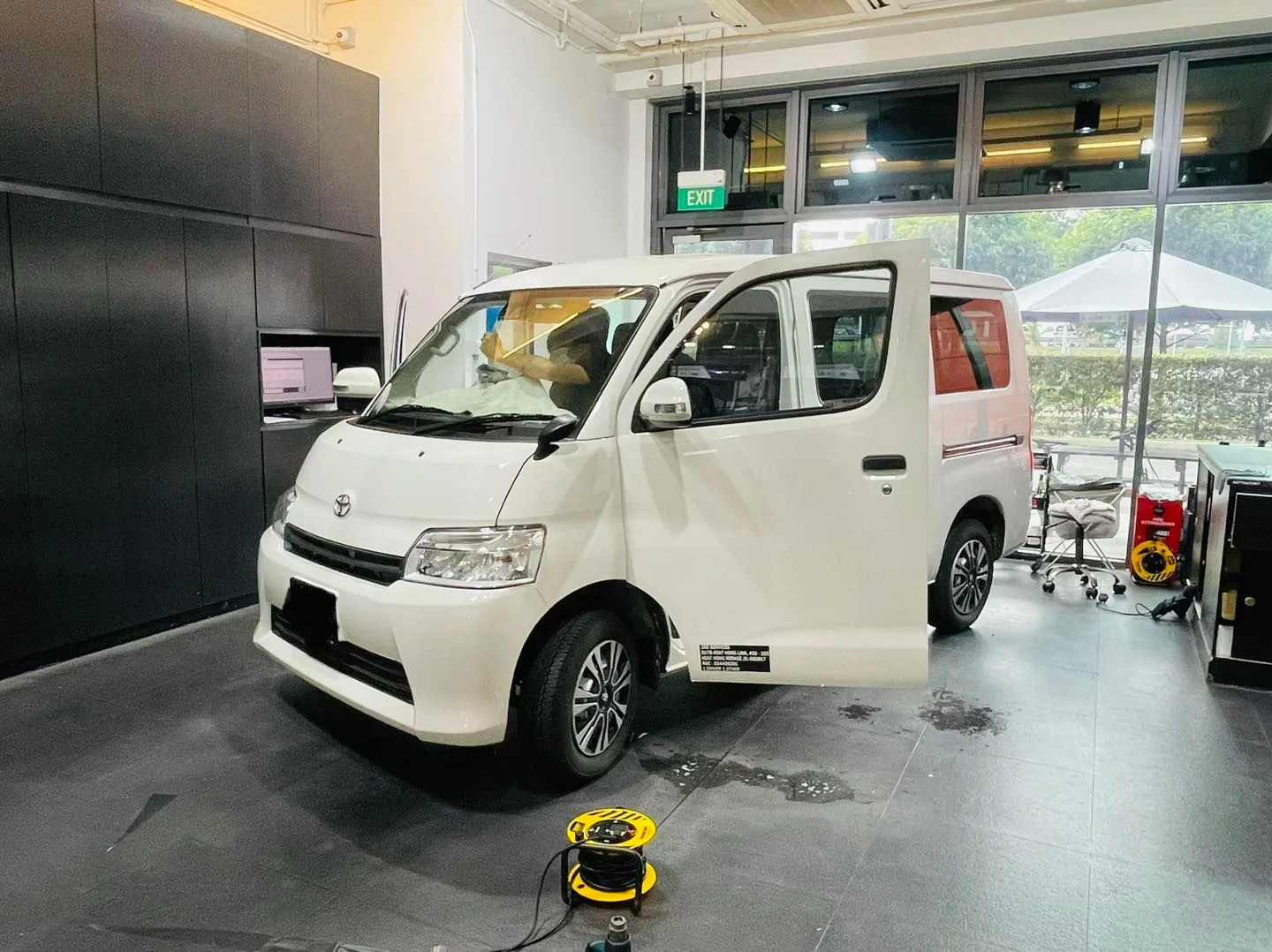 White Toyota Townace van side profile at Infratint Singapore for window film