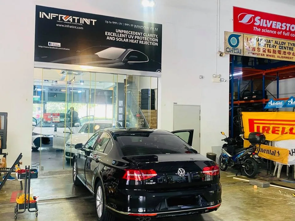 Black Volkswagen Passat rear view at Infratint Singapore window tinting bay
