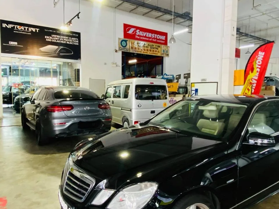 Grey Mercedes-Benz GLC Coupe and black E-Class at Infratint Singapore window tinting workshop