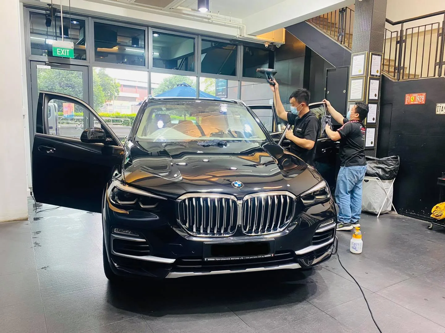 Black BMW SUV having window film applied at Infratint Singapore