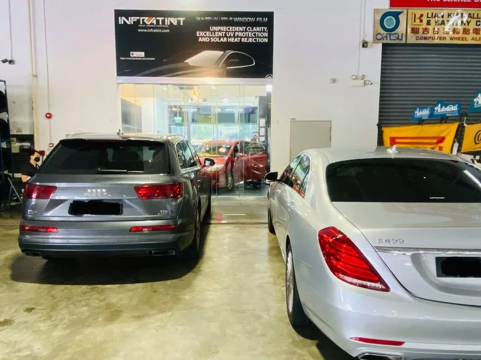 Grey Audi Q7 and silver Mercedes-Benz S-Class at Infratint Singapore install bay