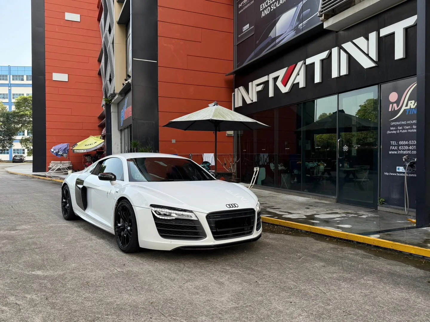 White Audi R8 front three-quarter view outside Infratint Singapore