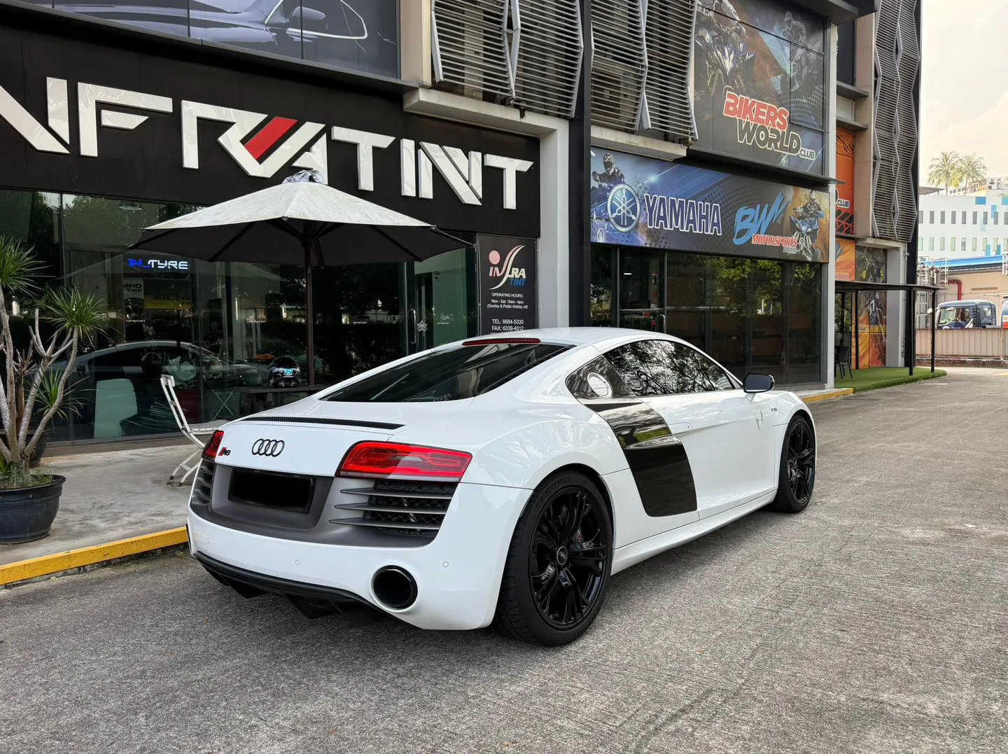 White Audi R8 rear three-quarter view outside Infratint Singapore