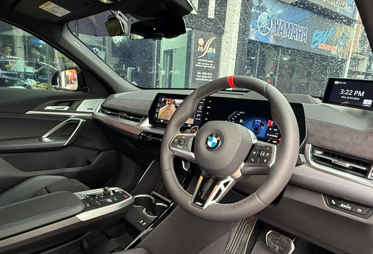BMW X2 curved display interior seen through tinted windscreen at Infratint Singapore