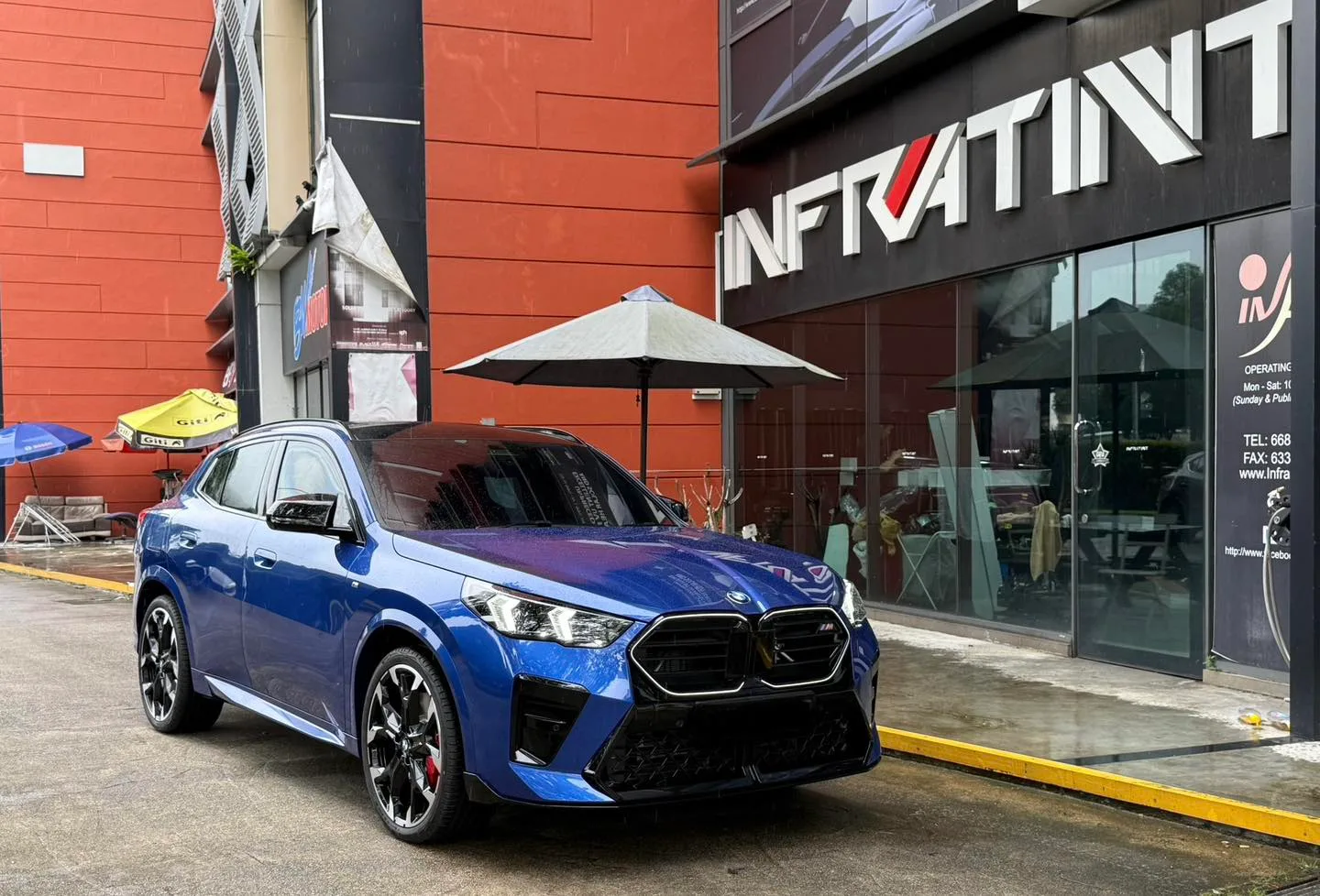 Blue BMW X2 front three-quarter view outside Infratint Singapore