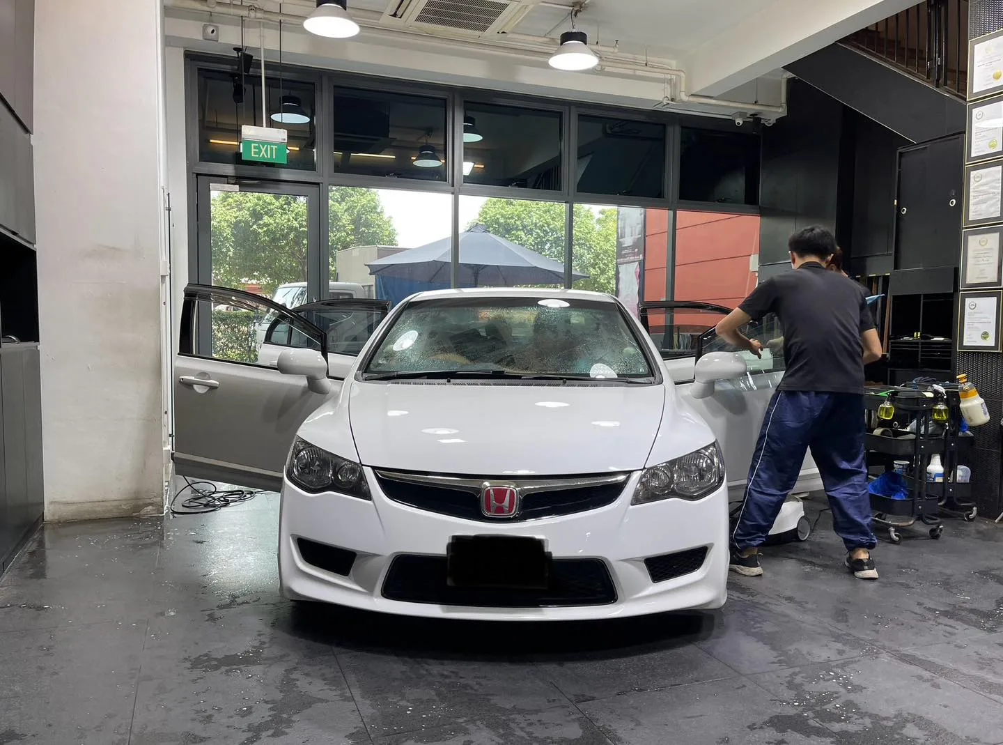 White Honda Civic Type R front view inside Infratint workshop during film installation