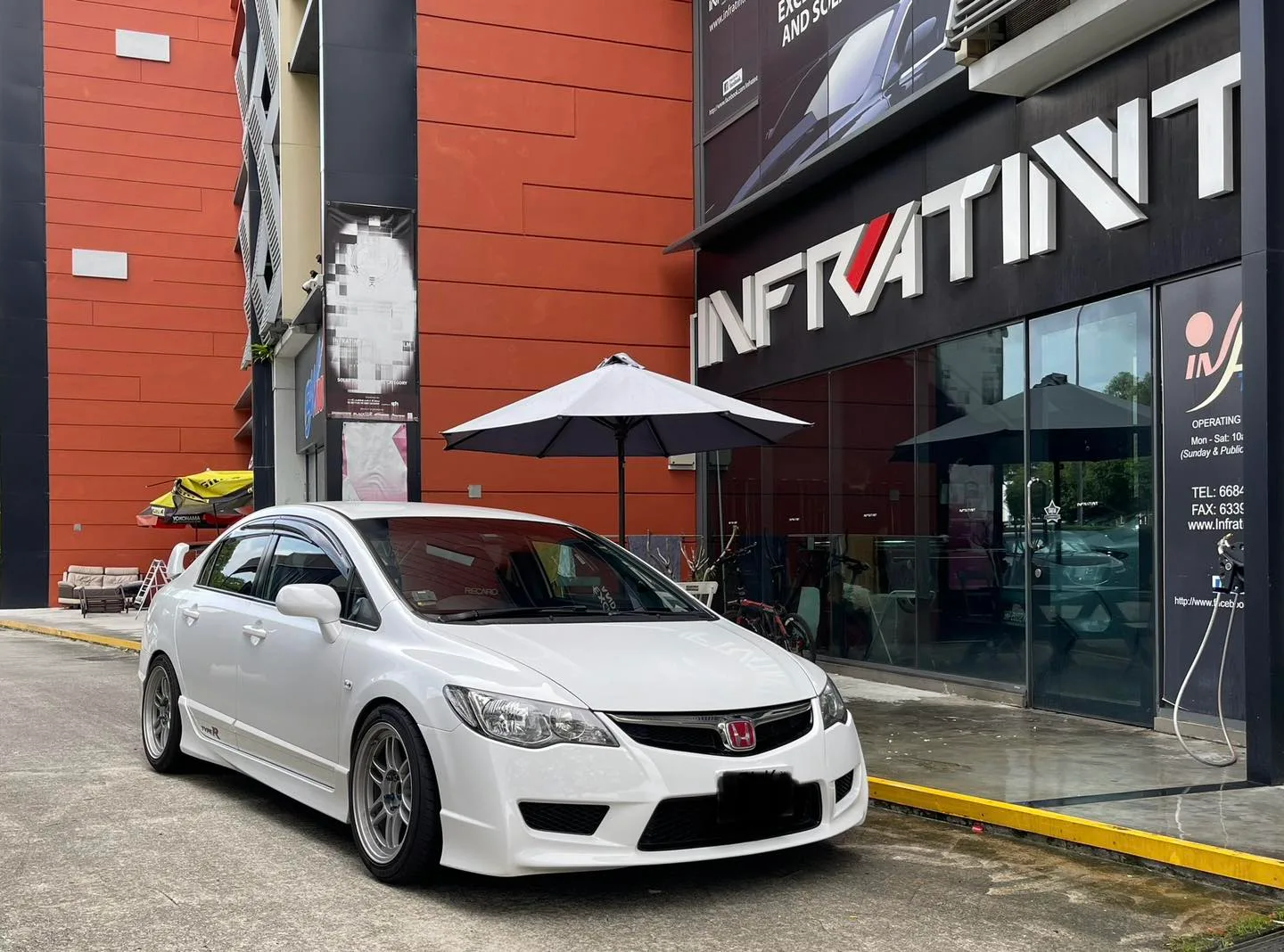 White Honda Civic Type R front three-quarter view outside Infratint Singapore