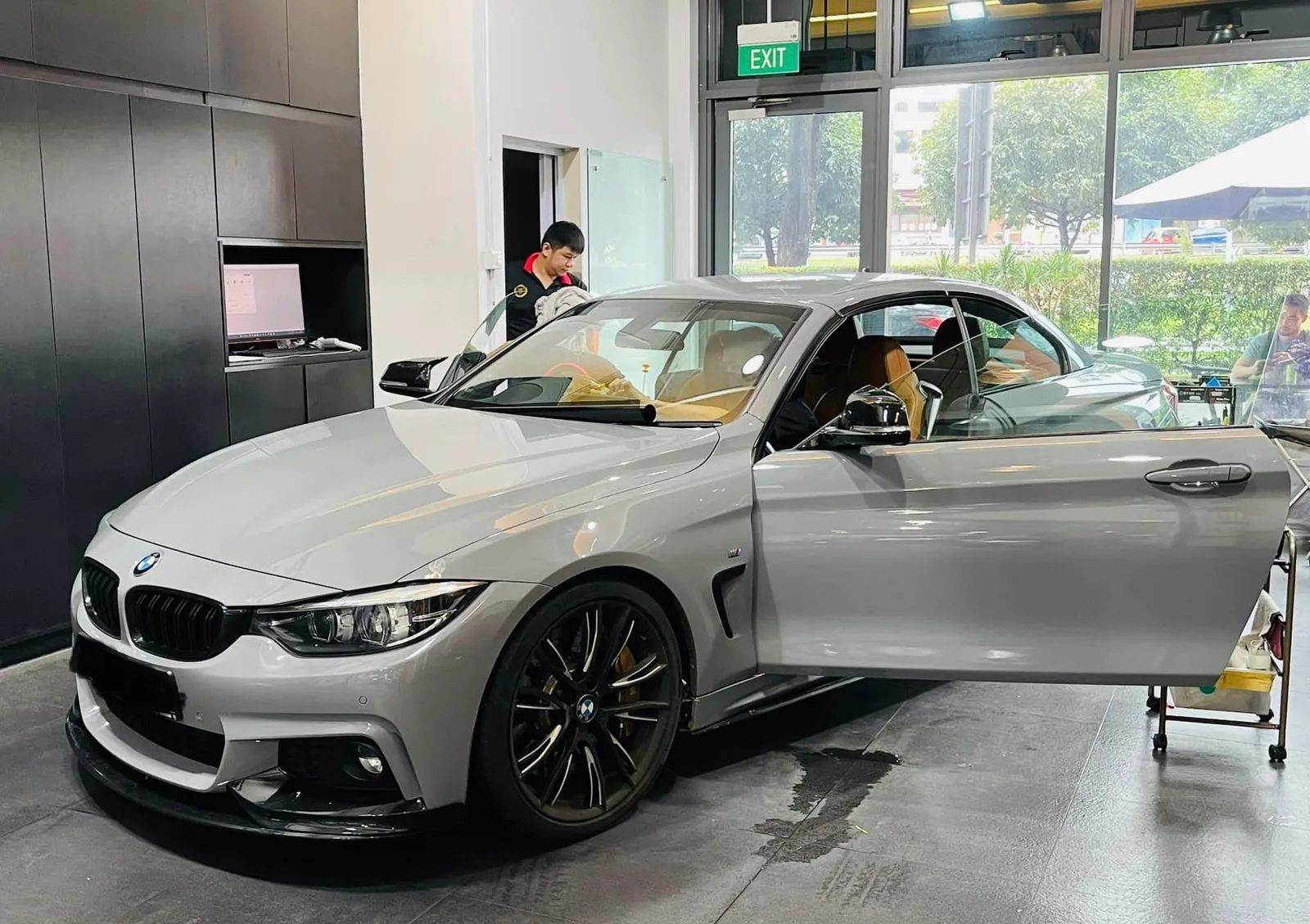 Grey BMW 4 Series coupe front three-quarter at Infratint Singapore for window tinting